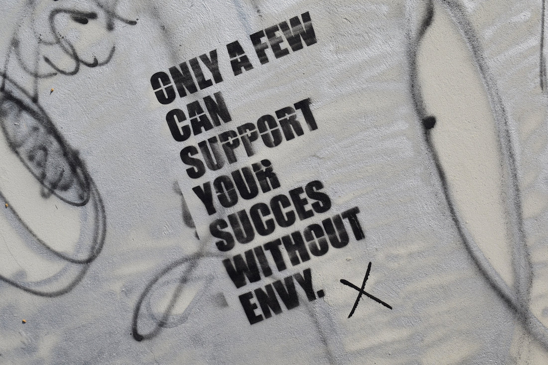 graffiti on the side of a wall that says only a few can support your success