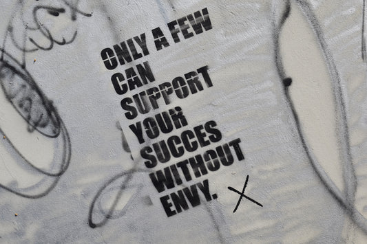 graffiti on the side of a wall that says only a few can support your success