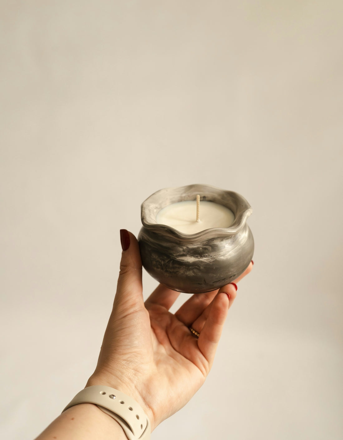 A person holding a candle in their hand